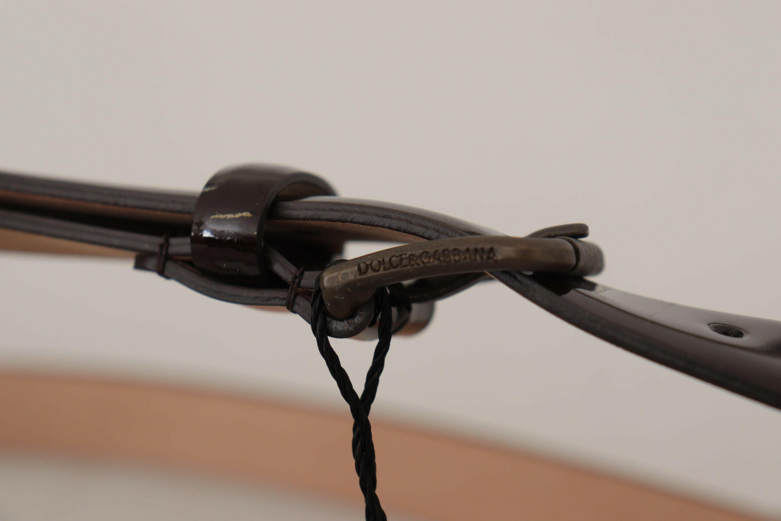 Dolce & Gabbana Black Patent Leather Logo Metal Waist Buckle Belt -   -  Dolce & Gabbana. Dolce & Gabbana Black Patent Leather Logo Metal Waist Buckle Belt -   -  Dolce & Gabbana.