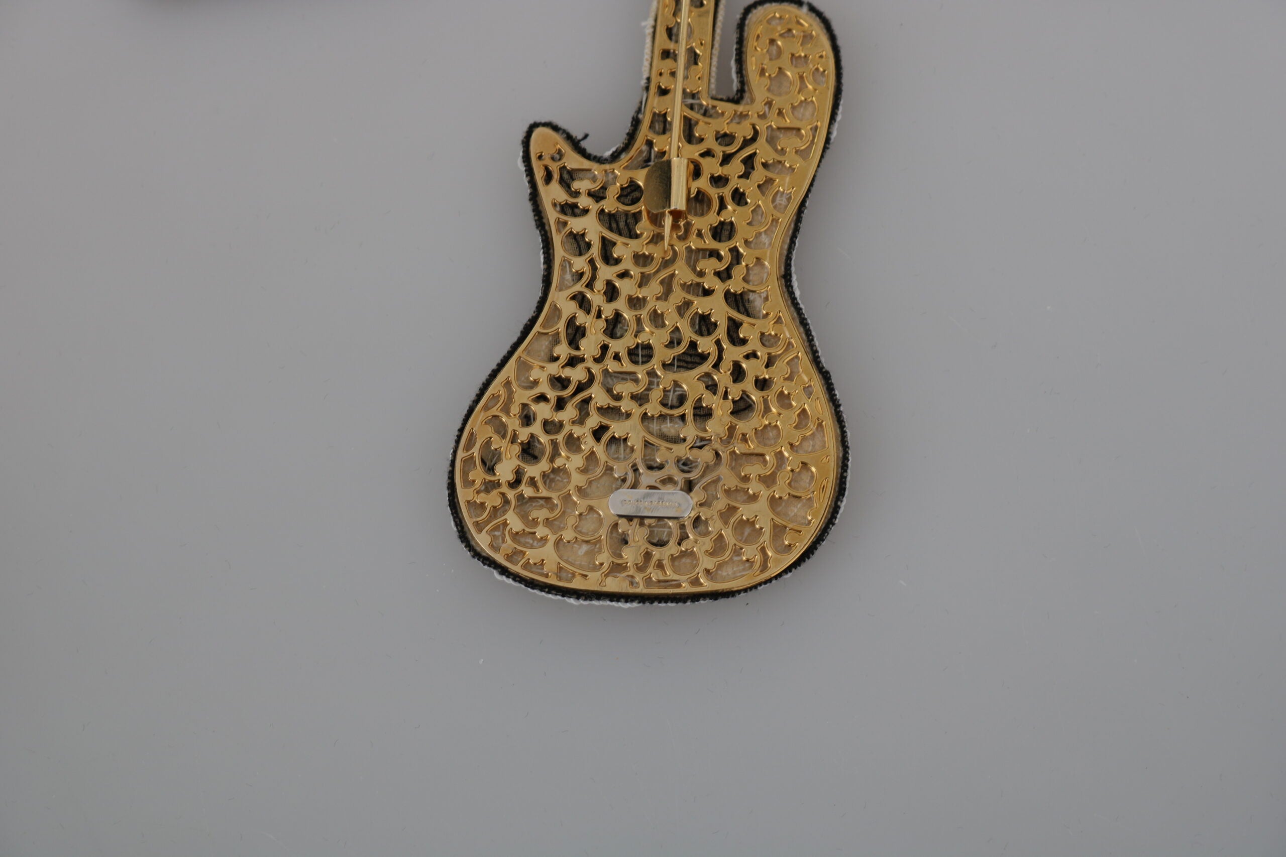Dolce & Gabbana Gold Brass Beaded Guitar Pin Accessory Brooch -   -  Dolce & Gabbana. Dolce & Gabbana Gold Brass Beaded Guitar Pin Accessory Brooch -   -  Dolce & Gabbana.