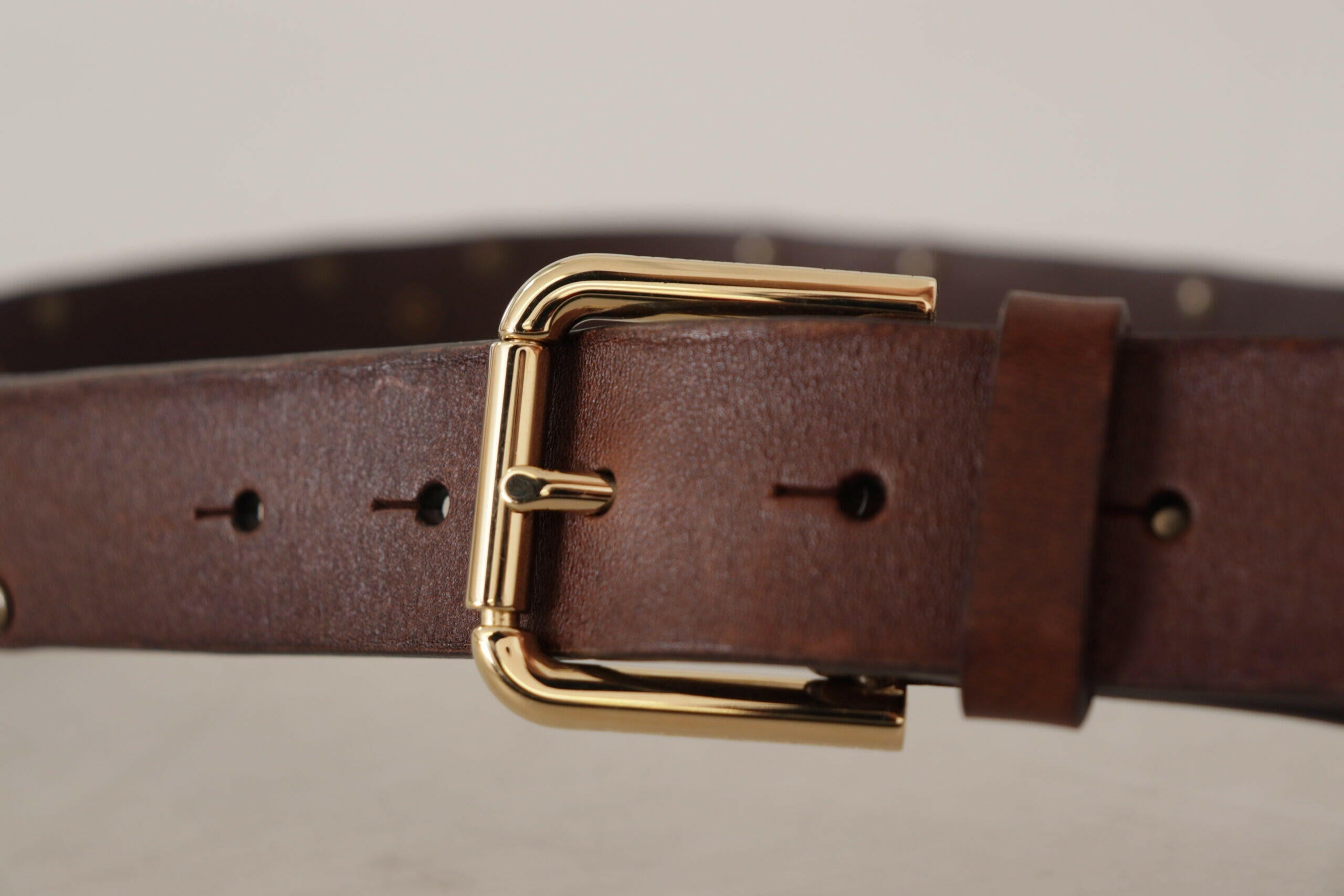 Dolce & Gabbana Brown Leather Studded Gold Tone Metal Buckle Belt -   -  Dolce & Gabbana. Dolce & Gabbana Brown Leather Studded Gold Tone Metal Buckle Belt -   -  Dolce & Gabbana.
