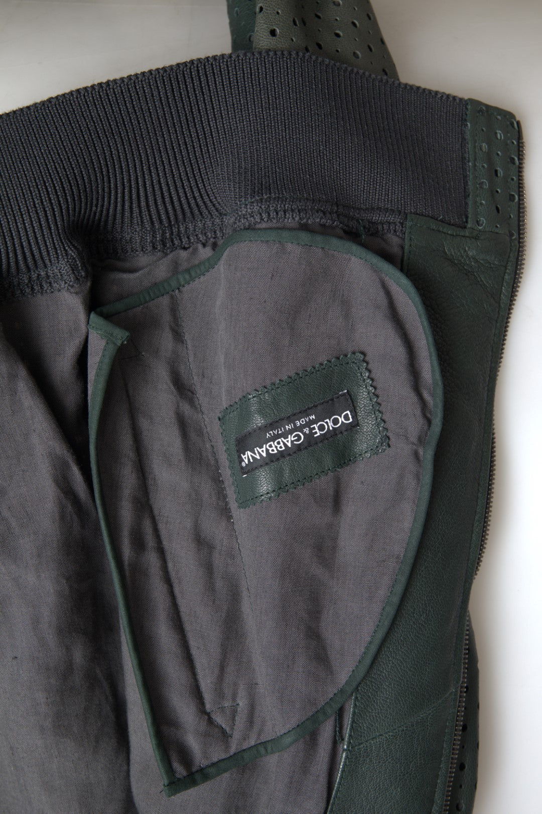 Dolce & Gabbana Green Perforated Leather Bomber Jacket -   -  Dolce & Gabbana. Dolce & Gabbana Green Perforated Leather Bomber Jacket -   -  Dolce & Gabbana.