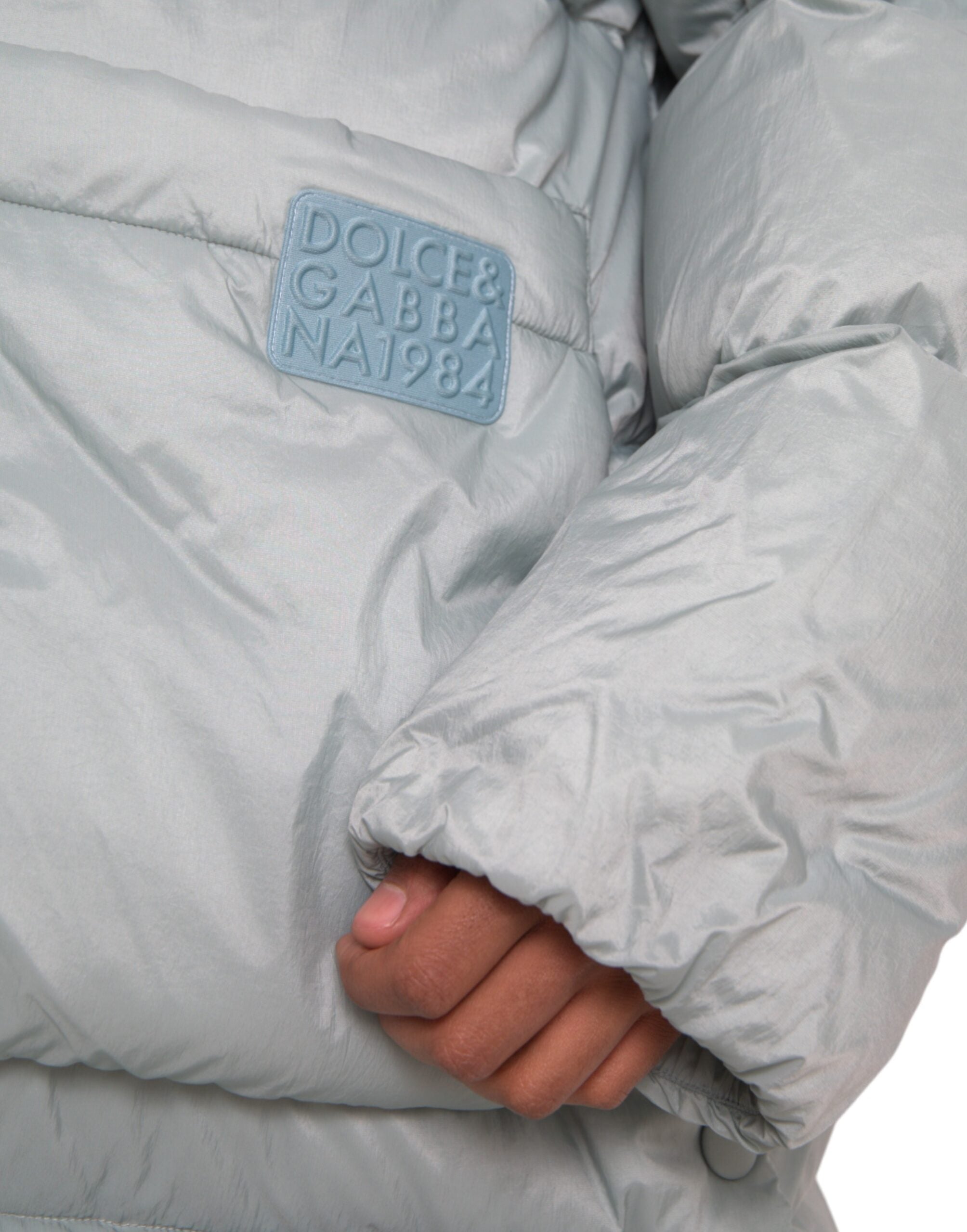 Dolce & Gabbana Light Blue Quilted Hooded Puffer Jacket Men -   -  Dolce & Gabbana. Dolce & Gabbana Light Blue Quilted Hooded Puffer Jacket Men -   -  Dolce & Gabbana.