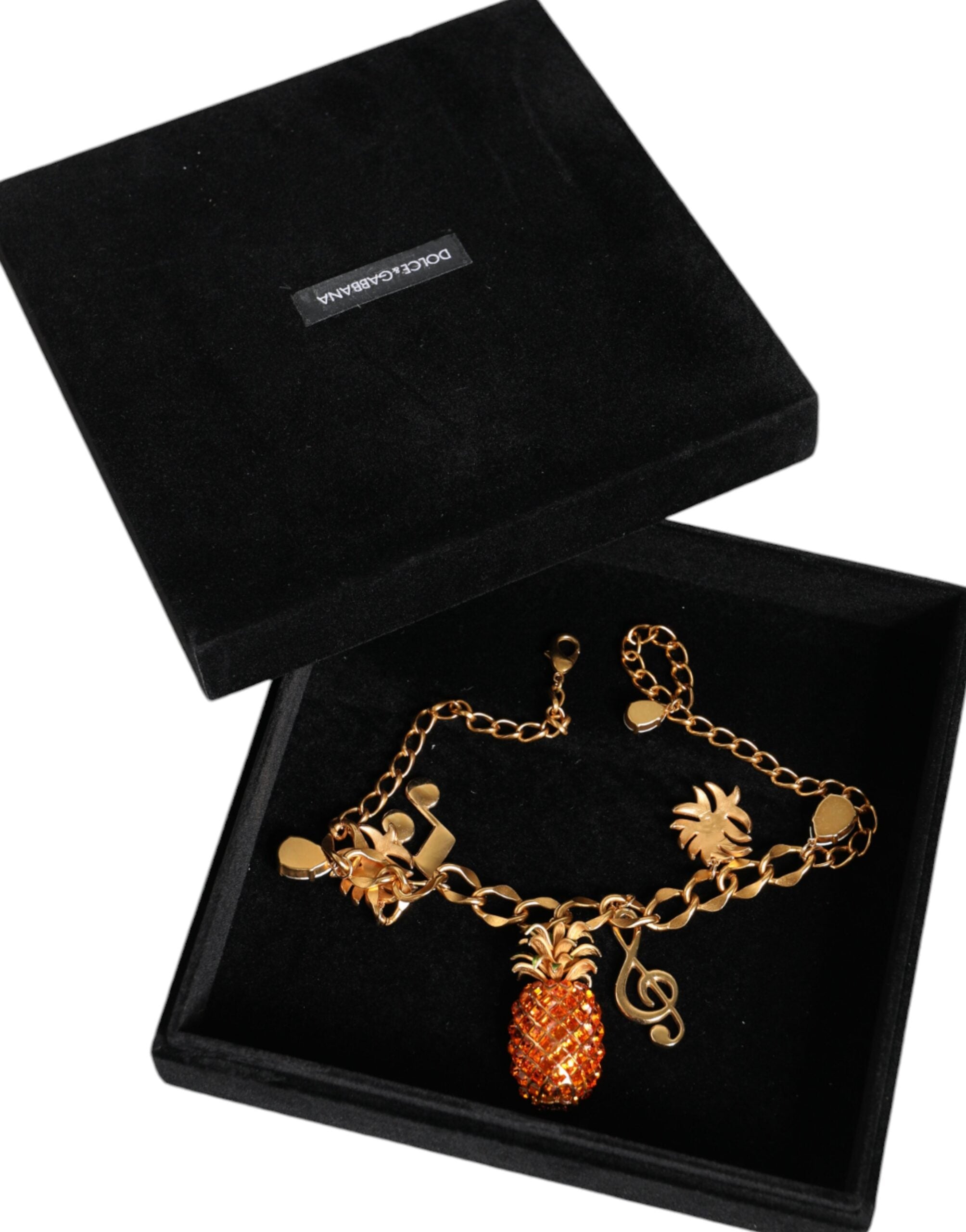 Dolce & Gabbana Gold Tone Brass Chain Pineapple Crystal Musical Necklace -   -  Dolce & Gabbana. Dolce & Gabbana Gold Tone Brass Chain Pineapple Crystal Musical Necklace -   -  Dolce & Gabbana.