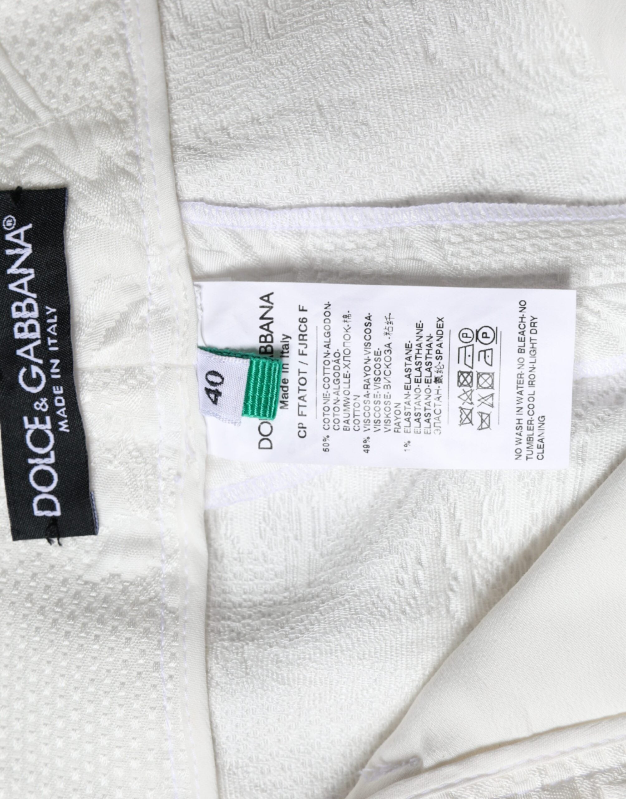Dolce & Gabbana White Floral Brocade Cotton Cropped Pants -   -  Dolce & Gabbana. Dolce & Gabbana White Floral Brocade Cotton Cropped Pants -   -  Dolce & Gabbana.