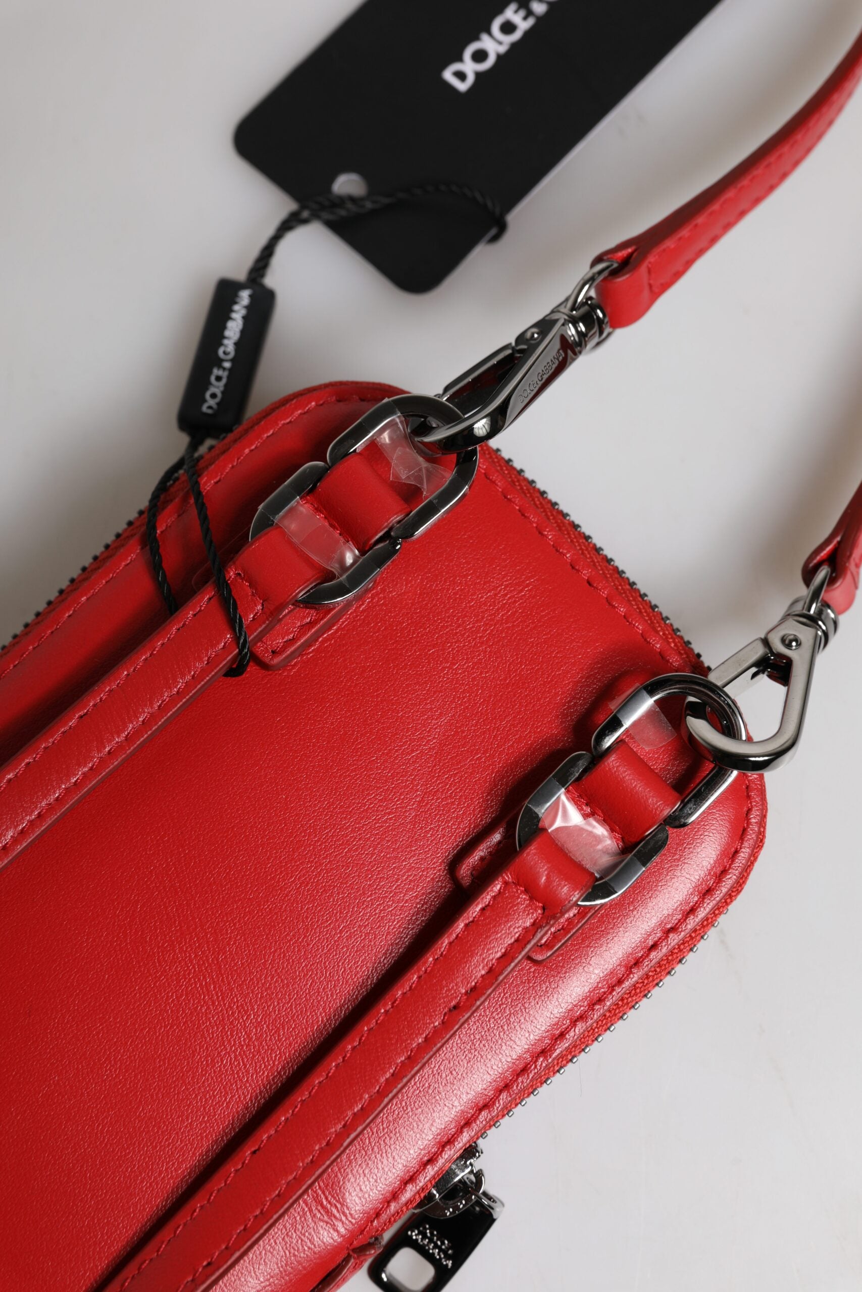 Dolce & Gabbana Red Leather Purse Phone Sling Crossbody Neck Strap Bag -   -  Dolce & Gabbana. Dolce & Gabbana Red Leather Purse Phone Sling Crossbody Neck Strap Bag -   -  Dolce & Gabbana.