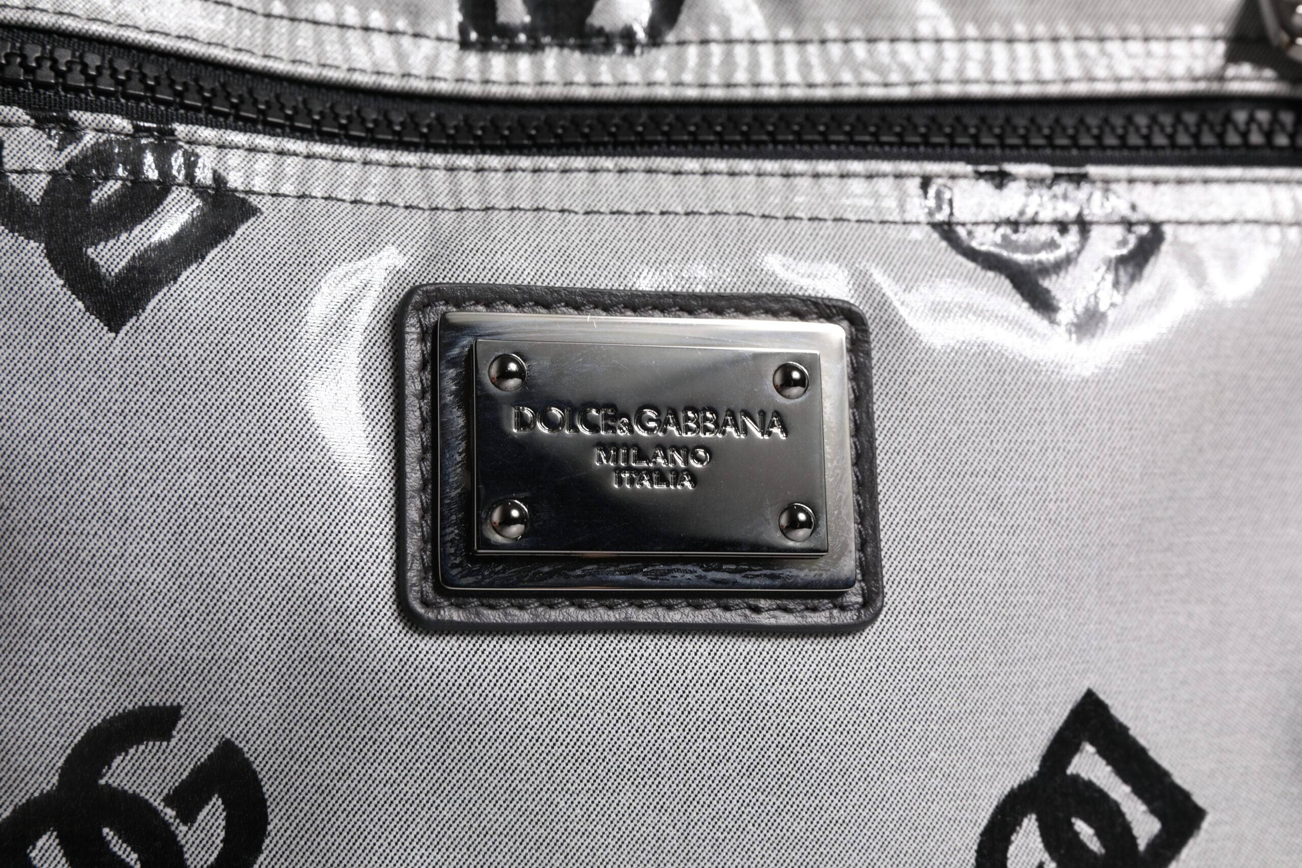 Dolce & Gabbana Polyester Gray Black DG Logo Plaque Backpack Bag -   -  Dolce & Gabbana. Dolce & Gabbana Polyester Gray Black DG Logo Plaque Backpack Bag -   -  Dolce & Gabbana.