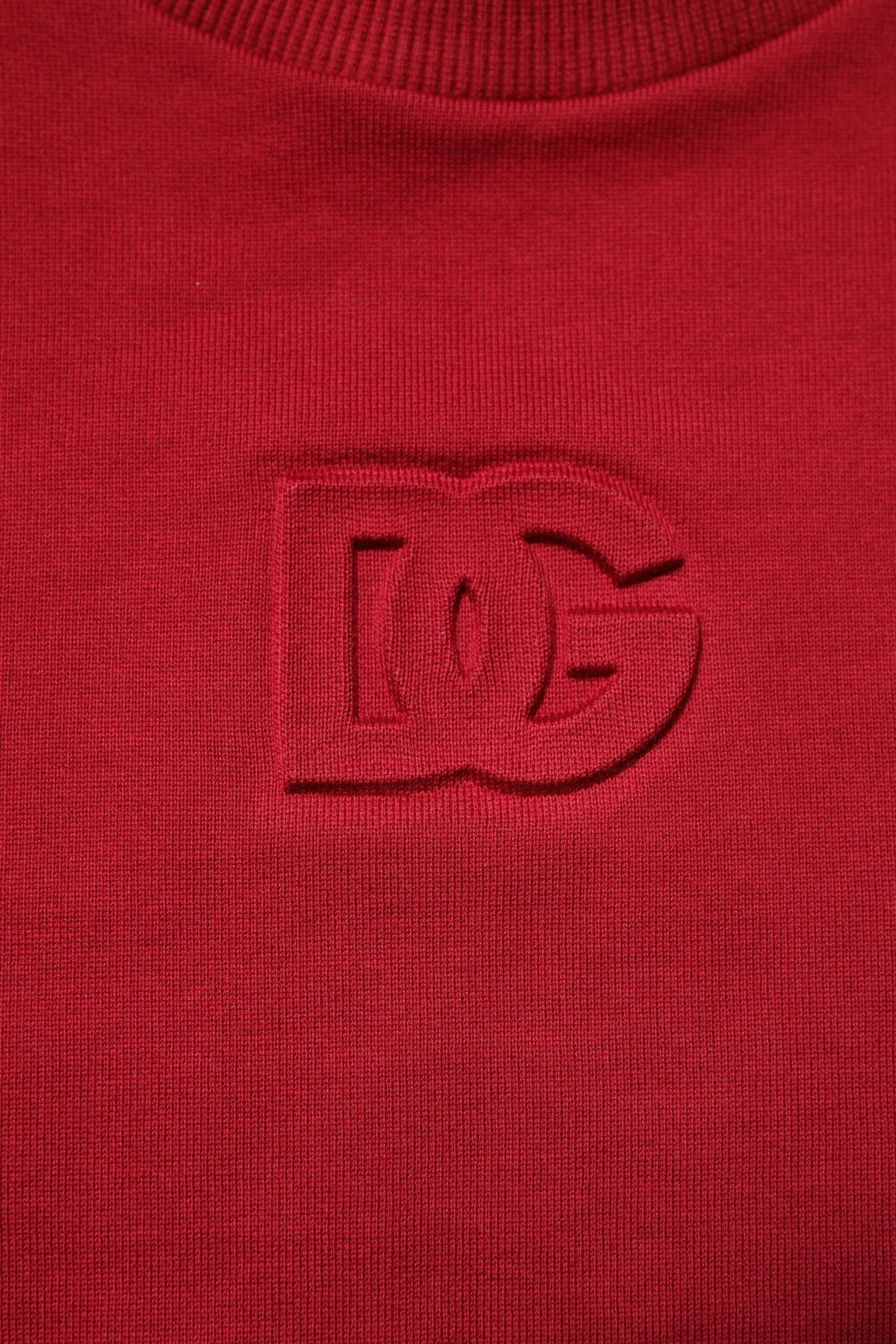 Dolce & Gabbana Red Embossed Logo Cotton Crew Neck Sweater -   -  Dolce & Gabbana. Dolce & Gabbana Red Embossed Logo Cotton Crew Neck Sweater -   -  Dolce & Gabbana.