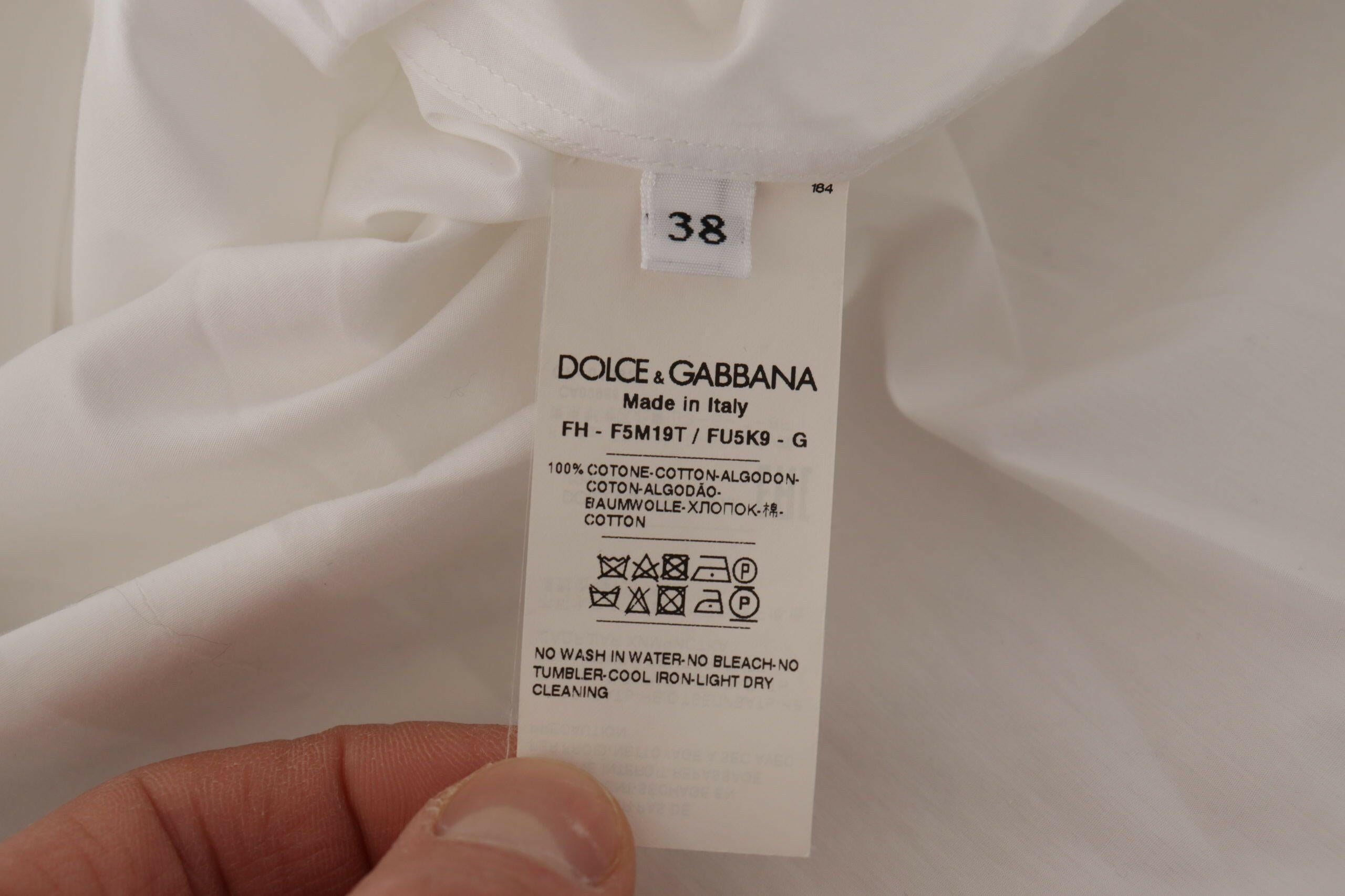 Dolce & Gabbana White Sleeveless Tuxedo Formal Blouse Top -   -  Dolce & Gabbana.