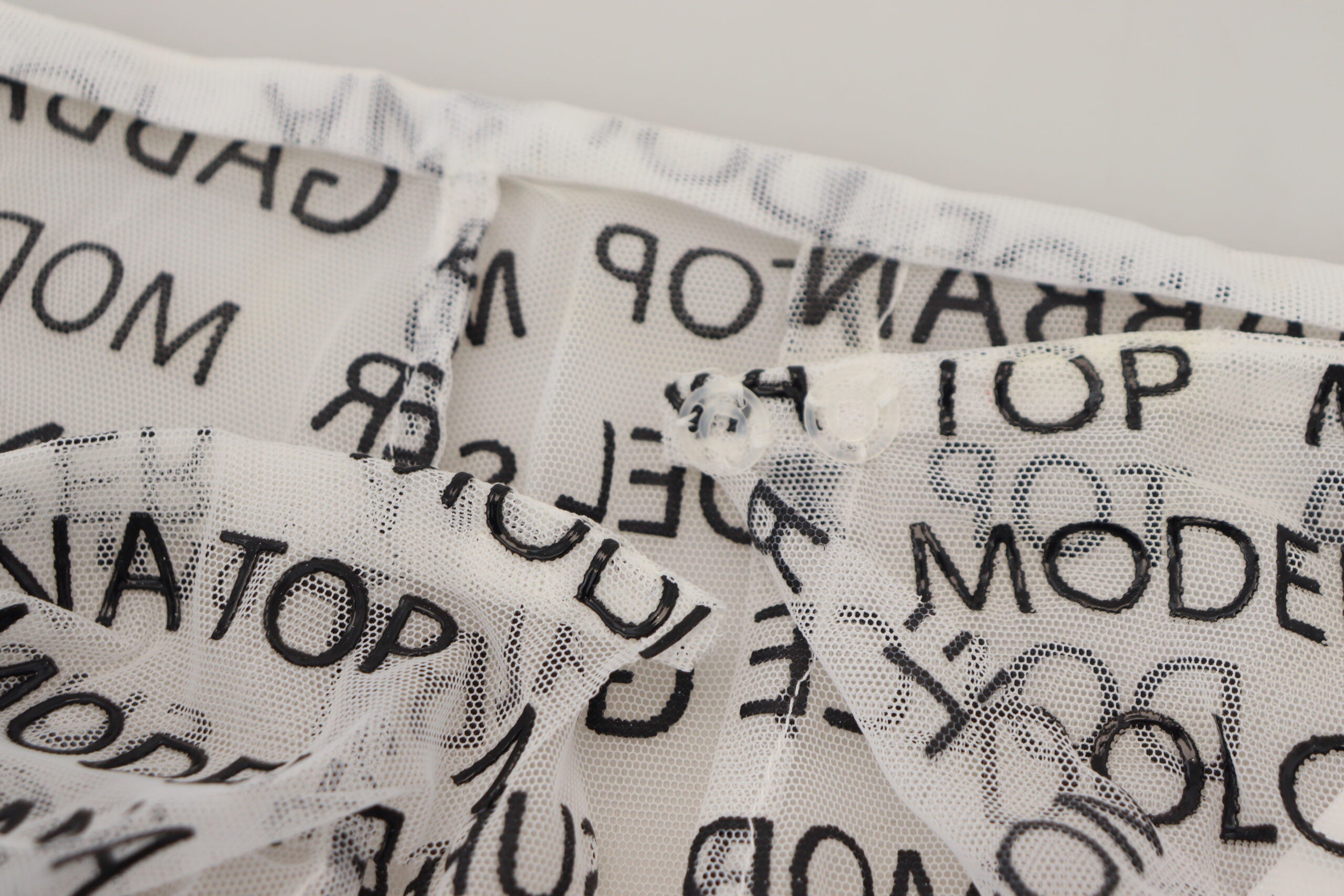 Dolce & Gabbana White Logo See Through A-line Mini Skirt -   -  Dolce & Gabbana.