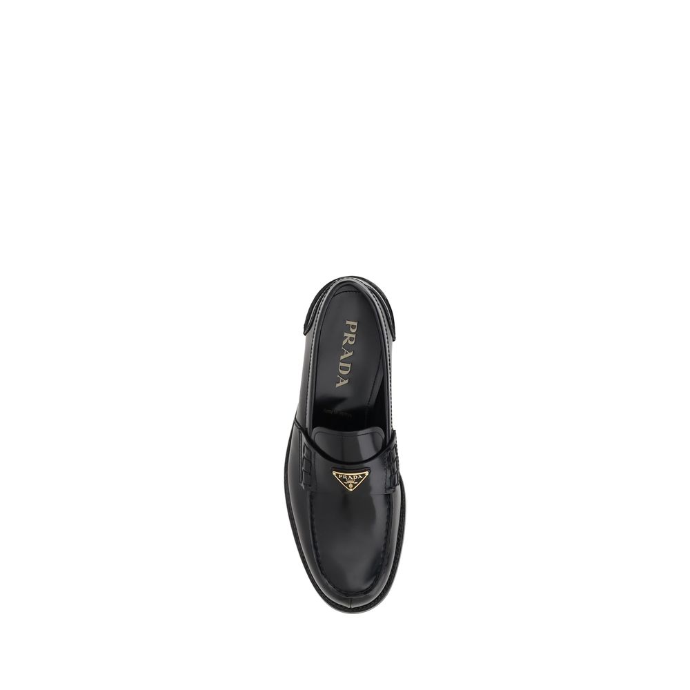 Prada Triangular plaque Loafers -   -  Prada.