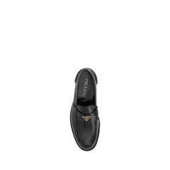 Prada Triangular plaque Loafers -   -  Prada.