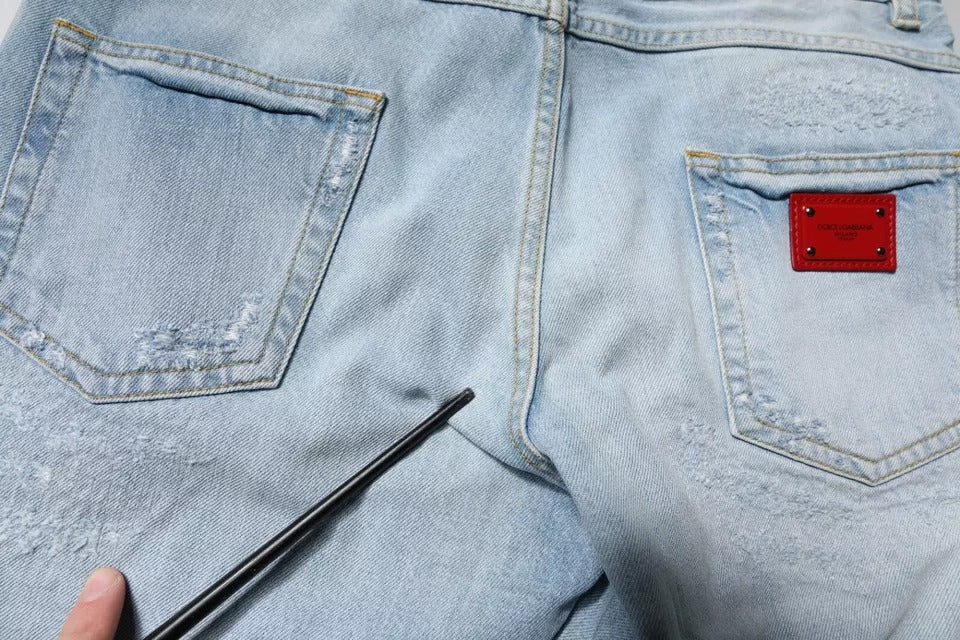 Dolce & Gabbana Light Blue Tattered Logo Skinny Denim Jeans -   -  Dolce & Gabbana.
