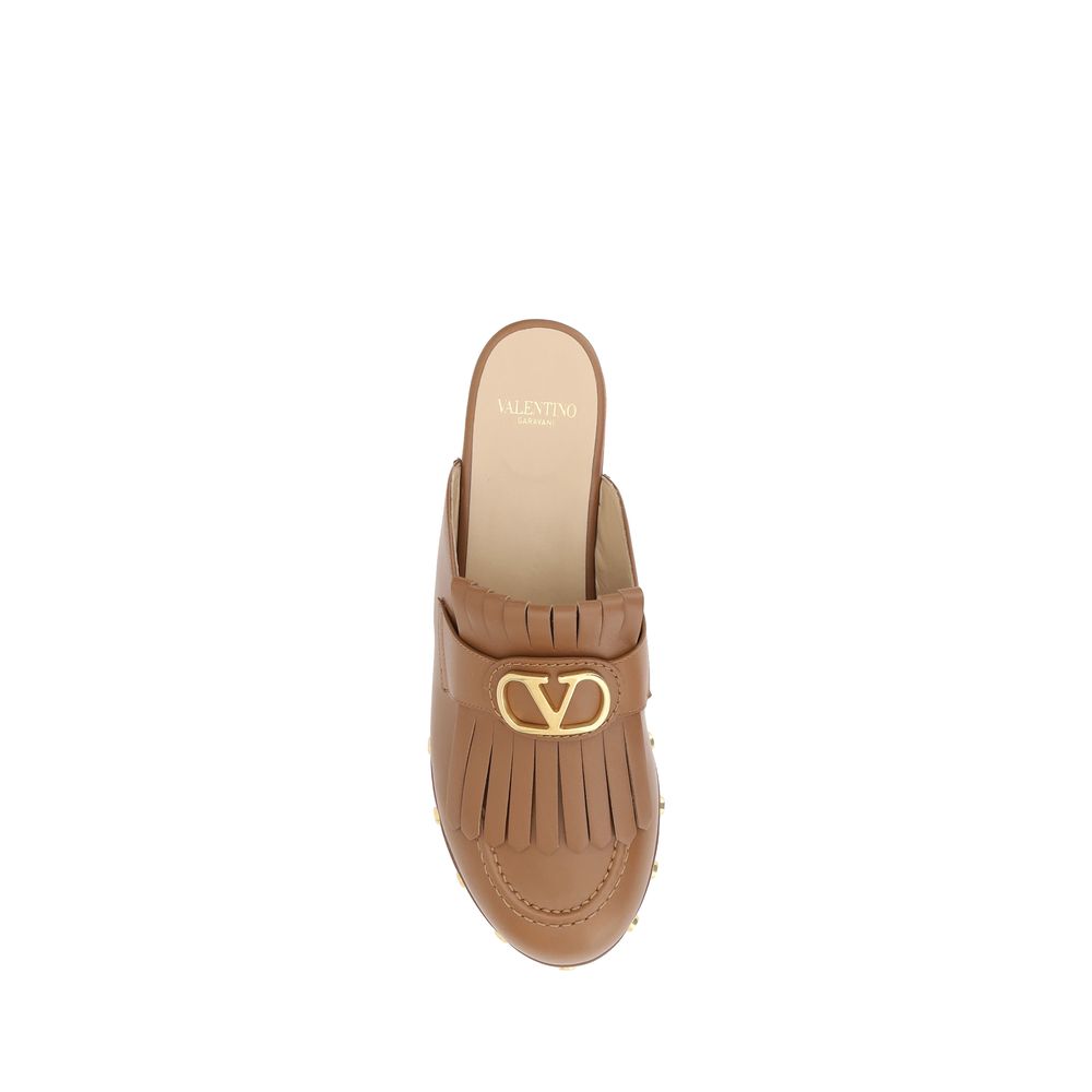 Valentino Garavani Leather Mules -   -  Valentino Garavani.