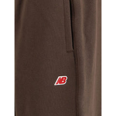 New Balance Elastic-waistband logo-patch track Pants -   -  New Balance.
